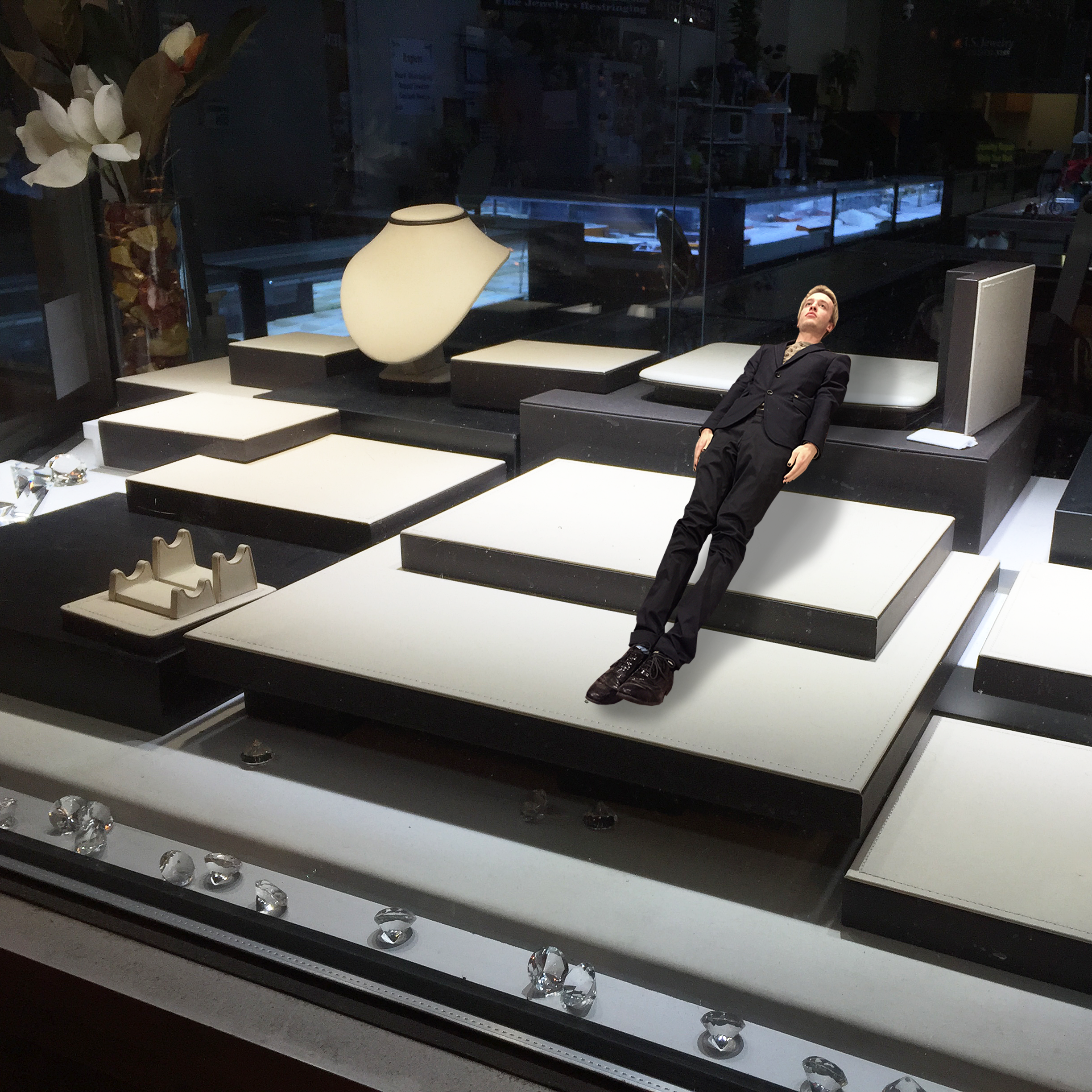 Butler's body floating over an empty jewlery display
